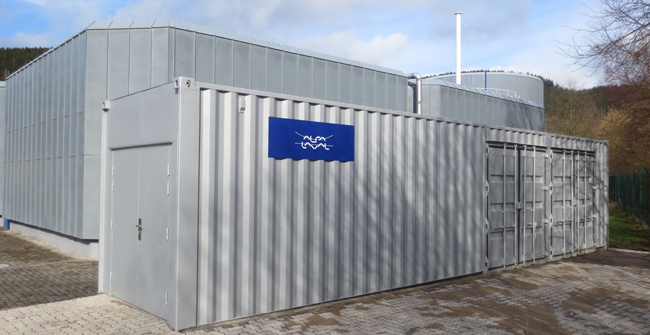 Ruhrverbund is one of Germany’s largest water management companies, operating 67 sewage treatment plants. Their Arnsberg-Wildshausen wastewater treatment plant recently replaced an outdated drum thickener with a containerized AS-H Belt Thickener from Alfa Laval. The unit contains everything needed for efficient sludge thickening including control cabinet, polymer system and other auxiliaries. Ruhrverband representatives visiting Alfa Laval’s stand at the 2014 IFAT trade fair saw an AS-H Belt Thickener on display and were impressed by its simplicity. After a competitive bidding process, involving other manufacturers, Ruhrverband chose to install a containerized version of this Alfa Laval solution. The new Alfa Laval AS-H Belt Thickener has now been running for more than six months. Mr. Kemper, plant foreman at tfacility, mentions the simplicity of the equipment. “The Alfa Laval AS-H Belt Thickener requires minimum operator input, and power and polymer consumption are low. There is not much automation, and systems such as hydraulics which require maintenance have been kept to a minimum. Yet the thickener’s patented ramp allows the thickened sludge solids to be precisely adjusted and fine tuned during operation. The system gives us a new level of reliability and performance flexibility enabling us to handle fluctuating load levels.” Smooth delivery including interim solution Installation and commissioning of the complete plant was also included in Alfa Laval’s scope of supply, and Alfa Laval’s Mid Europe Service technicians provided assistance during the start-up process. To bridge the gap between order and delivery of the containerized AS-H Belt thickener the Arnsberg-Wildshausen plant needed an interim solution for sludge thickening. Alfa Laval therefore provided an ALDRUM G3 Drum Thickener test unit for this. Container with Alfa Laval AS-H Belt thickener at Ruhrverbands Arnsberg wastewater plant